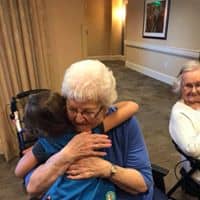 Resident hugging grandchild